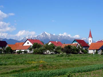 Mt. Kriváň is perhaps the most iconic peak in Slovakia's rugged High Tatra Mountains and is the site of traditional group ascents. The township of Pribylina sits in the foreground.